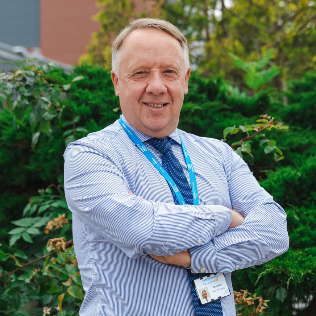 A man standing with his arms folded